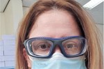 Kim Walker wearing face mask and protective frames